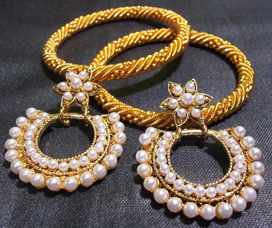 Golden jali bangles with flower polki